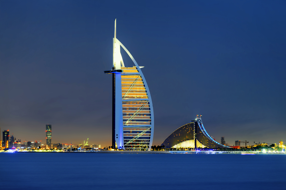 Skyline of Dubai by night from the water